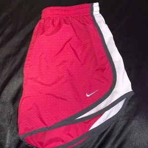 dark pink nike running shorts